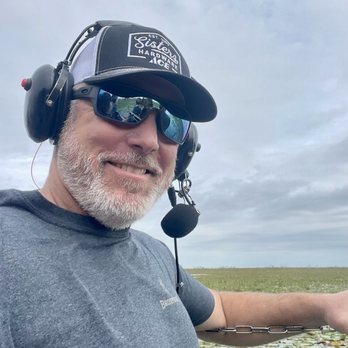 Swamp Donkey Airboat Rides - Headset on and ready - Boat Tours Near Me