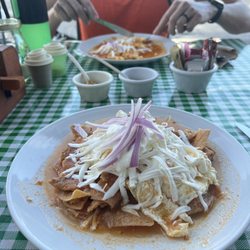 La Cocina de Silvia - Chilaquiles with red sauce and eggs over medium