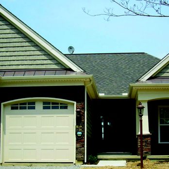 Project Express - the front of a house with two garages - General Contractors Near Me - Loveland, Ohio