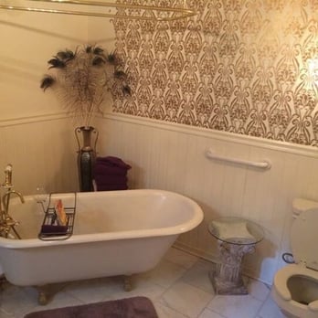 Dauphine House B & B - Gorgeous bathroom with claw foot tub and converted armoire sink - Bed & Breakfast Near Me - New Orleans, Louisiana Dauphine House B & B - Gorgeous bathroom with claw foot tub and converted armoire sink - Bed & Breakfast Near Me - New Orleans, Louisiana