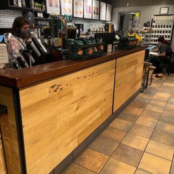 Starbucks - a customer at the counter of a coffee shop - Coffee & Tea Near Me - Raleigh, North Carolina