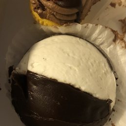 Black and white cookie and Boston cream cupcake. Black and white cookie and Boston cream cupcake.
