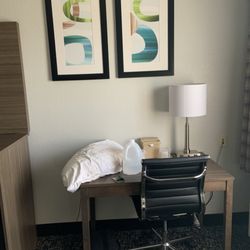 Quality Inn & Suites - Table and Chair Room 112.