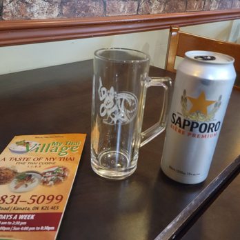 My Thai Village - a beer and a menu on a table - Thai Near Me - Ottawa, Ontario My Thai Village - a beer and a menu on a table - Thai Near Me - Ottawa, Ontario