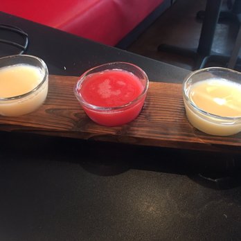 Bonchon Katy - The SOJU flight. From left to right it's the lychee, strawberry, and apple. - Chicken Wings Near Me - Katy, Texas Bonchon Katy - The SOJU flight. From left to right it's the lychee, strawberry, and apple. - Chicken Wings Near Me - Katy, Texas