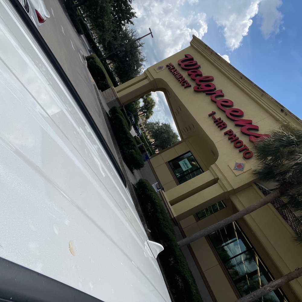 a view of a building with a sign that reads walnshows on it a view of a building with a sign that reads walnshows on it