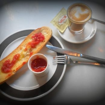 Chocolatería Valor - Traditional Spanish breakfast food: toasted bread with olive oil and tomato paste (Tostado con aceite de oliva y tomate) - Chocolatiers & Shops Near Me - Torrevieja, A