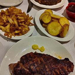 Sides were Fried onions and sliced potatoes Sides were Fried onions and sliced potatoes