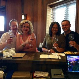 a group of people drinking wine a group of people drinking wine