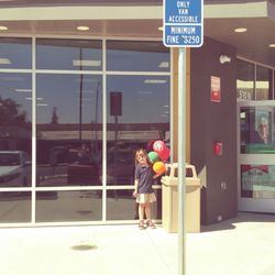 My granddaughter in front of the new store woohoo