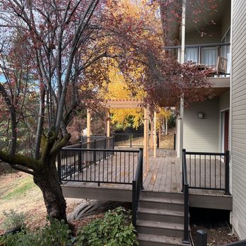 Householder Construction - a view of a deck with a tree in the foreground - General Contractors Near Me Householder Construction - a view of a deck with a tree in the foreground - General Contractors Near Me