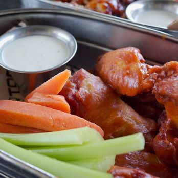 Topgolf - a bowl of chicken wings, carrots and celery - New American Near Me - San Antonio, Texas