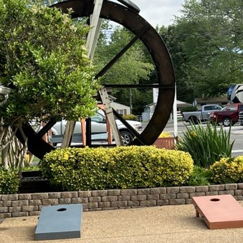 Anvil Campground - Nice water wheel and cornhole boards at entrance. - Campgrounds Near Me - Williamsburg, Virginia