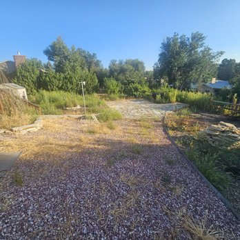 Weed Man - a view of a gravel driveway with a house in the background - Pest Control Near Me - Centennial, Colorado Weed Man - a view of a gravel driveway with a house in the background - Pest Control Near Me - Centennial, Colorado