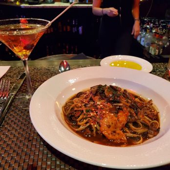 Camille's - Chicken Marsala over Linguine, with a Manhattan cocktail - Italian Near Me - Providence, Rhode Island Camille's - Chicken Marsala over Linguine, with a Manhattan cocktail - Italian Near Me - Providence, Rhode Island