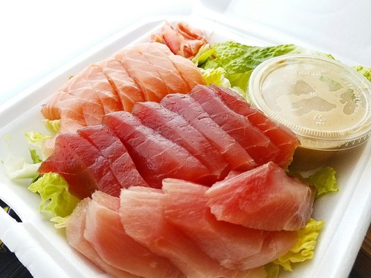 Photo of Ahi & Vegetable - Honolulu, HI, United States. Sashimi platter with mild salad dressing. (Ahi, salmon and hamachi). Salad dressing was delicious!!!