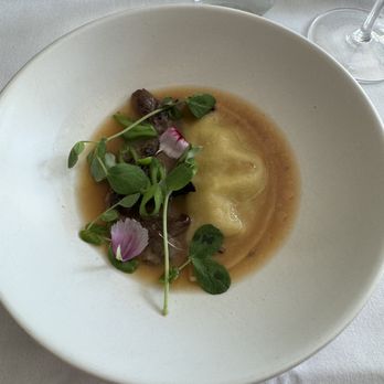 Fabrik - Austin - Grilled mushroom dumpling in ramen brodo with spring peas - Vegan Near Me - Austin, Texas