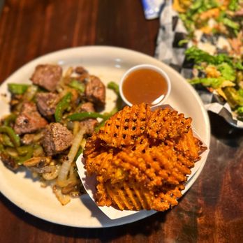 Mamut Bar and Grill - Steak Tips Sweet Potato Waffle Fries with a Caramel Dipping Sauce - Bars Near Me - Mount Sterling, Kentucky Mamut Bar and Grill - Steak Tips Sweet Potato Waffle Fries with a Caramel Dipping Sauce - Bars Near Me - Mount Sterling, Kentucky