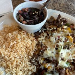Alambre with grilled steak, black beans and rice. Alambre with grilled steak, black beans and rice.
