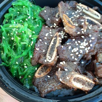 Lucky Lucky Dumpling - a person holding a bowl of food - Food Trucks Near Me - Oklahoma City, Oklahoma Lucky Lucky Dumpling - a person holding a bowl of food - Food Trucks Near Me - Oklahoma City, Oklahoma