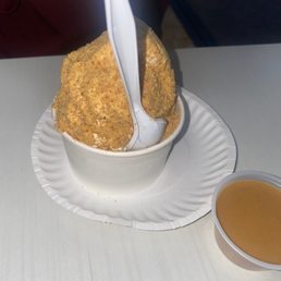 a person scooping into a bowl of yogurt