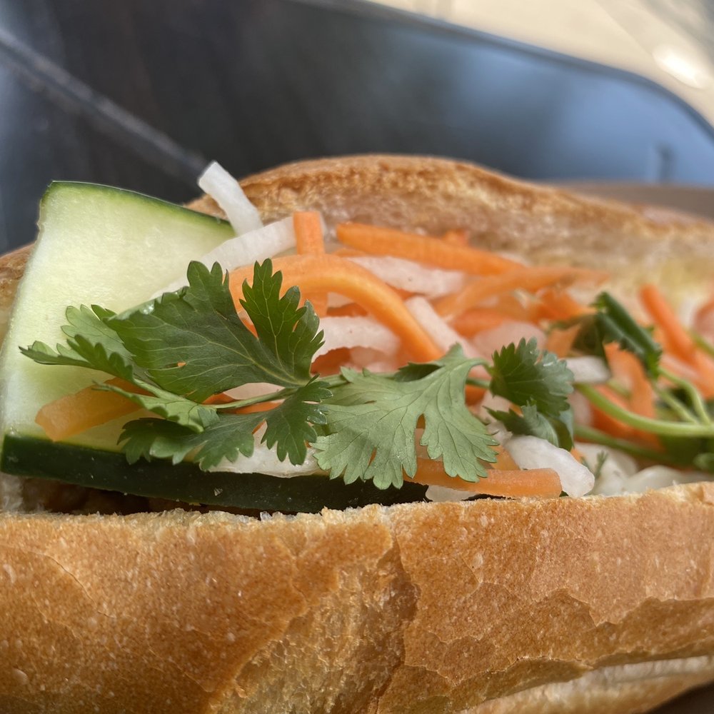 Pho Viet's - Bahn Mi- big juicy grilled pork underneath the pile of fresh pickles - Vietnamese Near Me - Boston, Massachusetts Pho Viet's - Bahn Mi- big juicy grilled pork underneath the pile of fresh pickles - Vietnamese Near Me - Boston, Massachusetts