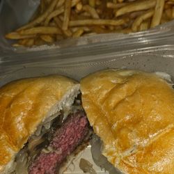 Rossi's Bar & Grill - Mushroom and Swiss burger which also comes with sauteed onions which is a great deal cooked  perfectly