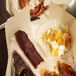 Ovens of France - Cinnamon bun, chocolate mouse cake, eclair, lemon meringue, and a pecan maple pie
