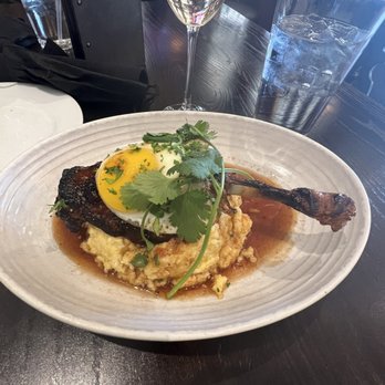 The Manship Wood Fired Kitchen - Duck leg and grits - New American Near Me - Jackson, Mississippi The Manship Wood Fired Kitchen - Duck leg and grits - New American Near Me - Jackson, Mississippi