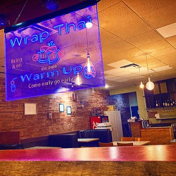 Wrap Thai Fusion - a neon sign in a restaurant - Thai Near Me - Sarasota, Florida Wrap Thai Fusion - a neon sign in a restaurant - Thai Near Me - Sarasota, Florida