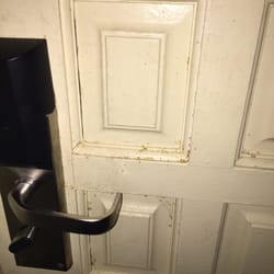 Super 8 by Wyndham MotelTallahassee - Dirt and grime on the room door.