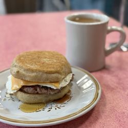 Sausage breakfast sandwich and coffee