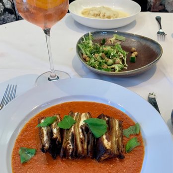 Al-Posto - Eggplant Parmesan and chickpea salad behind it - Italian Near Me - Cincinnati, Ohio Al-Posto - Eggplant Parmesan and chickpea salad behind it - Italian Near Me - Cincinnati, Ohio