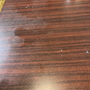 Polito's Pizza - a close up of a wooden table - Pizza Near Me - La Crosse, Wisconsin Polito's Pizza - a close up of a wooden table - Pizza Near Me - La Crosse, Wisconsin