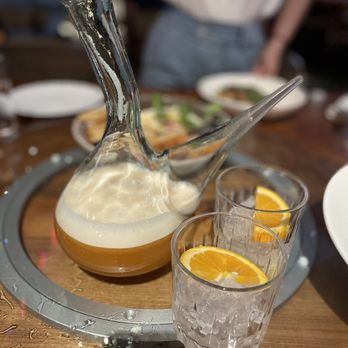 Irene's - a pitcher of liquid and two glasses of orange juice - Italian Near Me - New Orleans, Louisiana Irene's - a pitcher of liquid and two glasses of orange juice - Italian Near Me - New Orleans, Louisiana