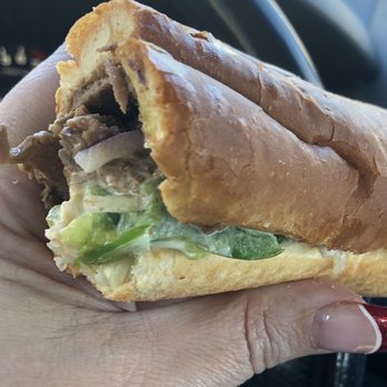 Subway - a person holding a sandwich in their hand - Sandwiches Near Me - Pleasant Grove, Utah Subway - a person holding a sandwich in their hand - Sandwiches Near Me - Pleasant Grove, Utah