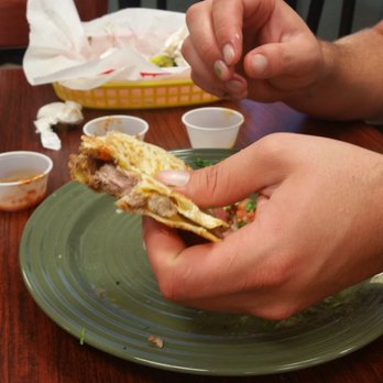 Taco Jalisco - We didn't take photos of everything.. but this is the boyfriend devouring my pork quesadilla. So good!! - Mexican Near Me - Sarasota, Florida Taco Jalisco - We didn't take photos of everything.. but this is the boyfriend devouring my pork quesadilla. So good!! - Mexican Near Me - Sarasota, Florida