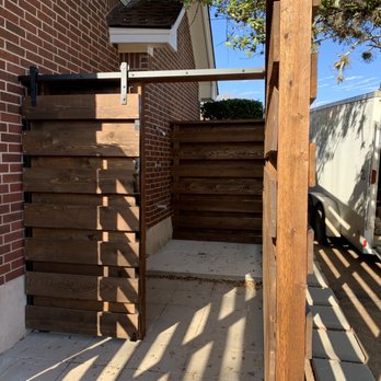 JTB Construction Services - Outdoor shower with sliding barn door. - Decks & Railing Near Me - Liberty Hill, Texas