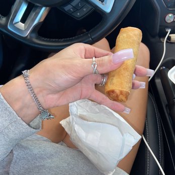 Hunan Chinese Restaurant - a woman eating a pastry - Chinese Near Me - Giddings, Texas