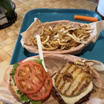 Kua' Aina Sandwich - Small fries. Grilled pineapple burger with Swiss, lettuce, tomato & onions. - Sandwiches Near Me - Haleiwa, Hawaii Kua' Aina Sandwich - Small fries. Grilled pineapple burger with Swiss, lettuce, tomato & onions. - Sandwiches Near Me - Haleiwa, Hawaii