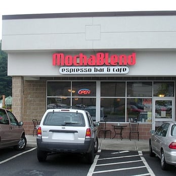 MochaBlend Cafe - two cars parked in a parking lot - Coffee & Tea Near Me - Troy, New York