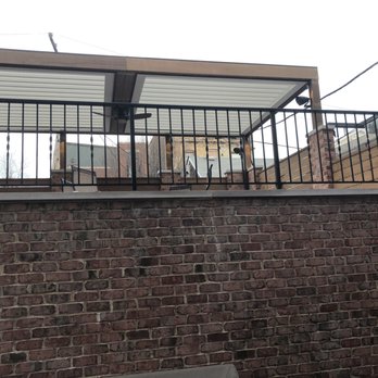 M Fabrications - a brick wall with a metal railing - General Contractors Near Me - Franklin Park, Illinois