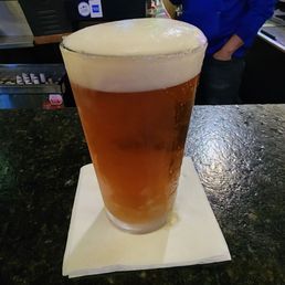 a pint of beer on the bar a pint of beer on the bar