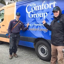 The Comfort Group - Technicians standing in front of Comfort Group truck
