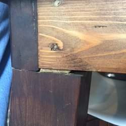 SDS Designs - Legs slapped together with wood piece shoved into gap that fell out and crumbled.