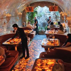 The disco cave has what resembles a waterfall in the back.