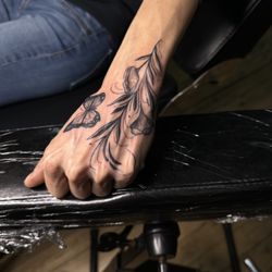 Silver Ink Tattoo - Little hand tattoo by Michael James