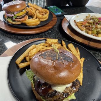 Alaskan Burger & Brew - Texas cheese burger w/fries, Mex burger w/onion rings, loaded fries - Burgers Near Me - Anchorage, Alaska Alaskan Burger & Brew - Texas cheese burger w/fries, Mex burger w/onion rings, loaded fries - Burgers Near Me - Anchorage, Alaska
