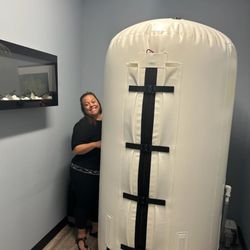 Lake in the Hills Family Chiropractic - Niki setting up the Hyperbaric Chamber
