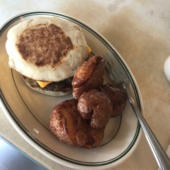 Palace Diner - Breakfast sandwich with cheddar and sausage, on the side of the famous palace potatoes. - Breakfast & Brunch Near Me - Biddeford, Maine
